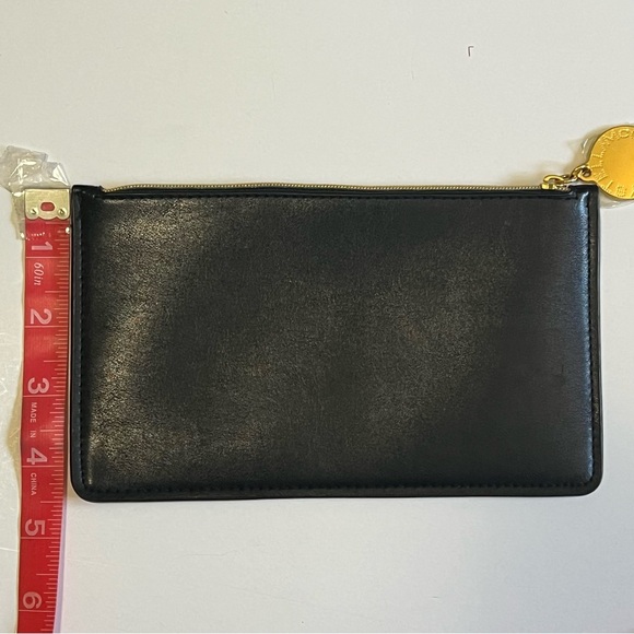 Stella McCartney NWOT Black Logo Zip Pouch Wristlet Gold Medallion Clutch